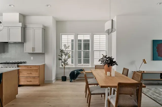 a view of a dining room with furniture and window