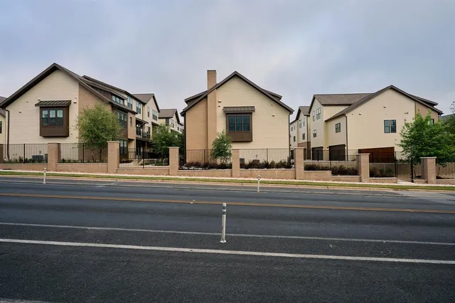a view of a house and a car park