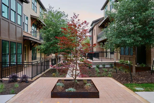 a view of a house with brick walls