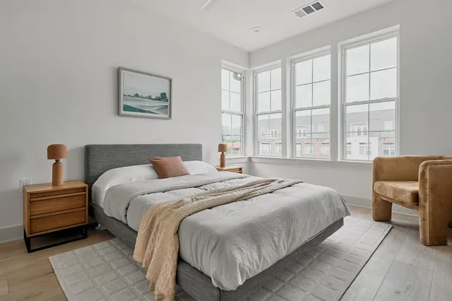 a bedroom with bed and window