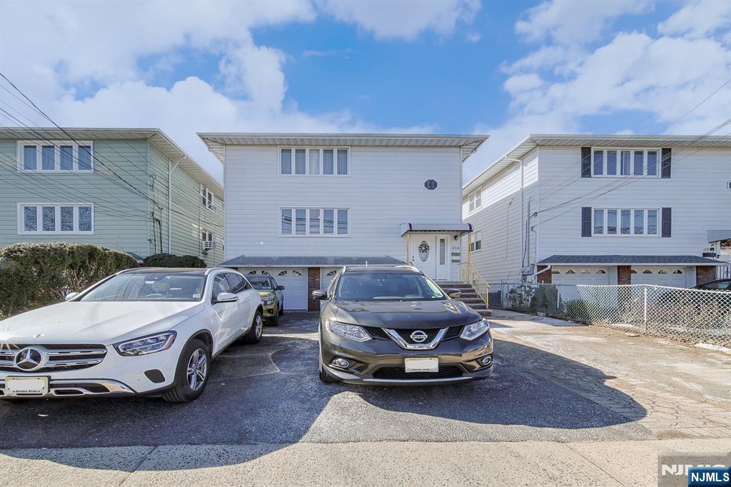 314 Garibaldi Avenue, Unit 1 Lodi, NJ 07644 - Photo 1 of 35 a car parked in front of a building