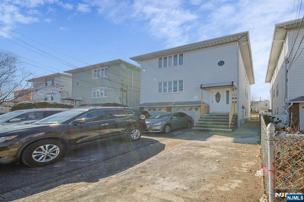 314 Garibaldi Avenue, Unit 1 Lodi, NJ 07644 - Photo 2 of 35 a view of a car parked in front of a house