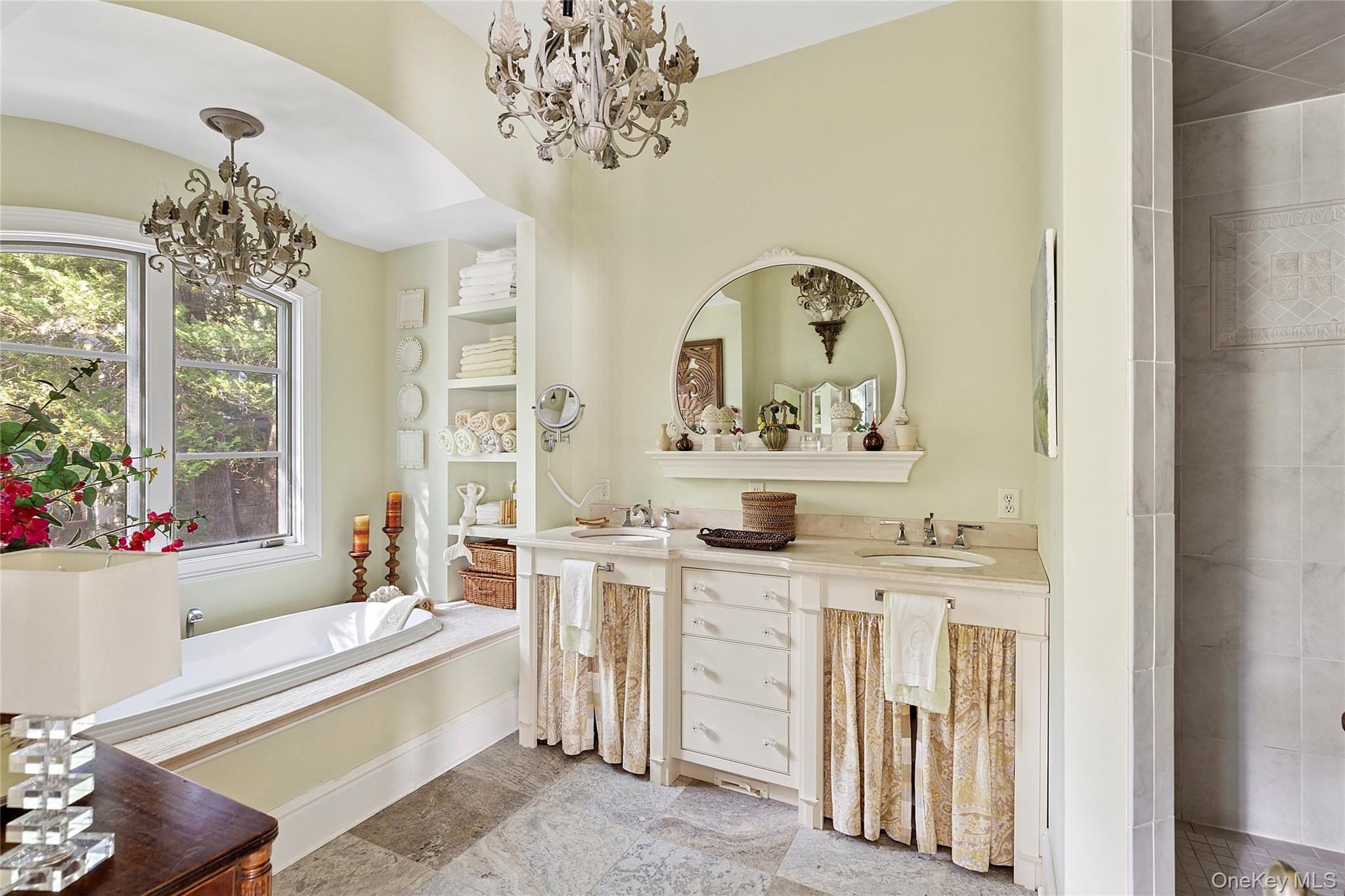 19 Ridge Lane Miller Place, NY 11764 - Photo 13 of 28 Bathroom with a chandelier, double vanity, a garden tub, and a tile shower