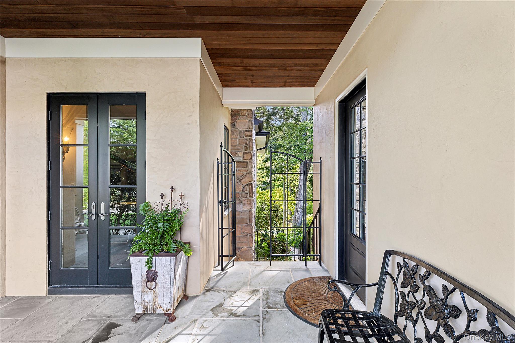 19 Ridge Lane Miller Place, NY 11764 - Photo 25 of 28 View of exterior entry featuring french doors, stucco siding, and a gate