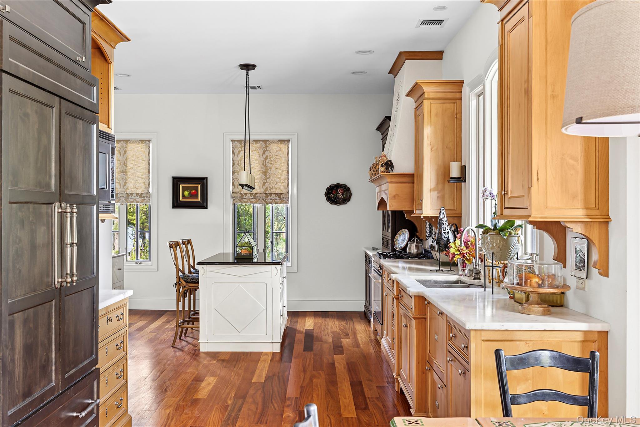 19 Ridge Lane Miller Place, NY 11764 - Photo 6 of 28 Kitchen featuring dark wood-type flooring, pendant lighting, healthy amount of natural light, and high quality appliances