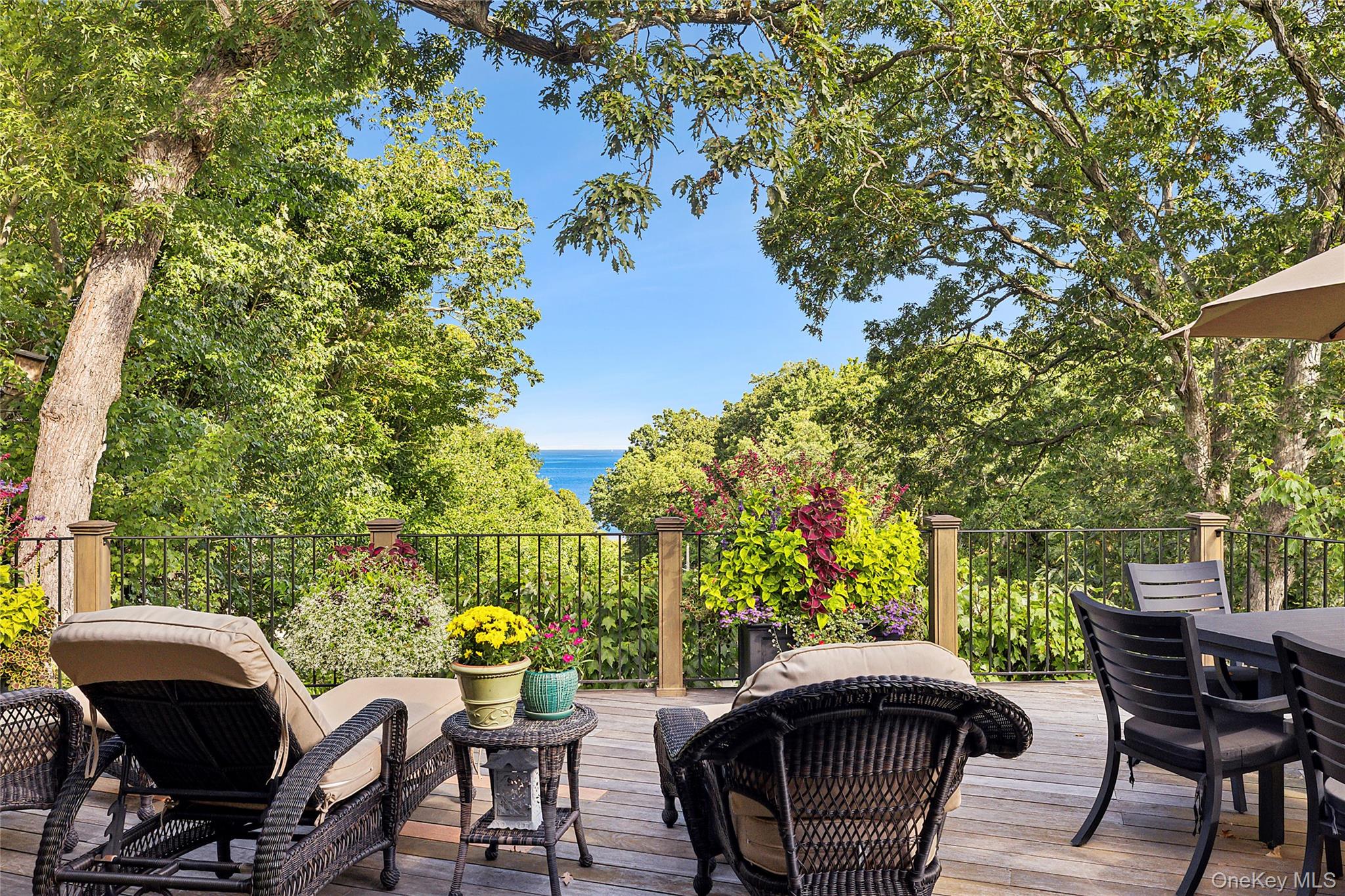 19 Ridge Lane Miller Place, NY 11764 - Photo 9 of 28 Wooden terrace with a water view and outdoor dining area