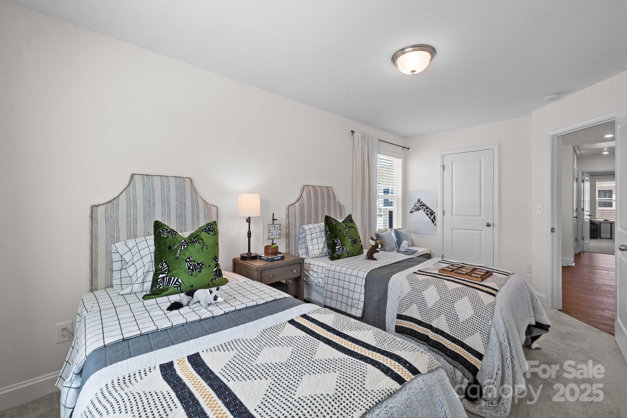 2919 Herringbone Road, Unit 39 Charlotte, NC 28208 - Photo 18 of 22 a bedroom with a bed and a couch