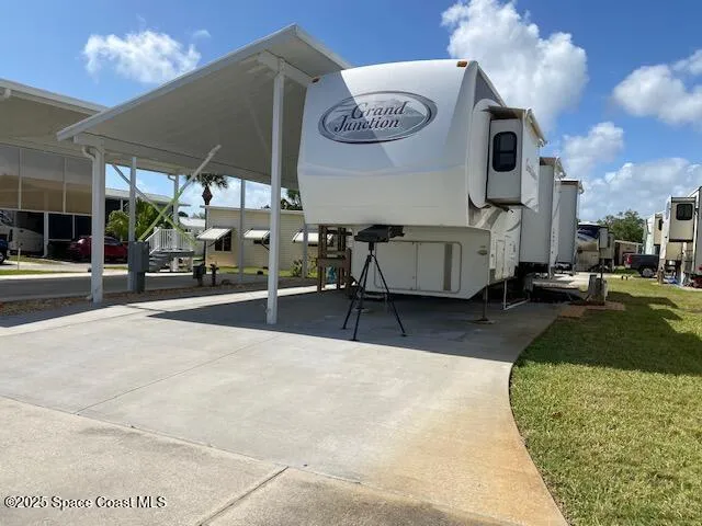 a view of a patio with table and chairs a barbeque