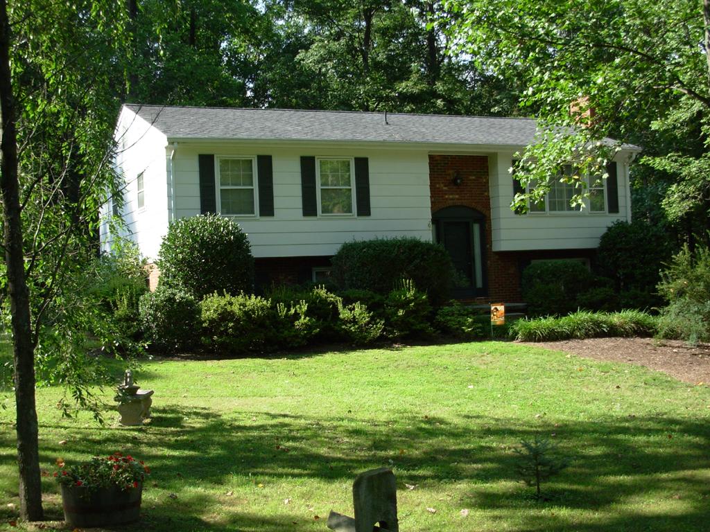 63 Cedarbrook Lane Blue Ridge, VA 24064 - Photo 1 of 14 a front view of a house with garden