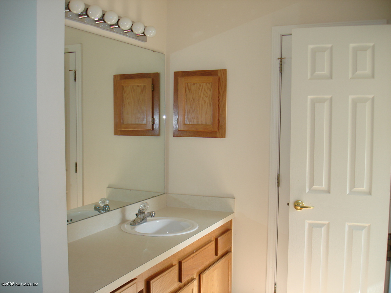 2933 Biloxi Trail Middleburg, FL 32068 - Photo 7 of 8 a bathroom with a sink and a mirror