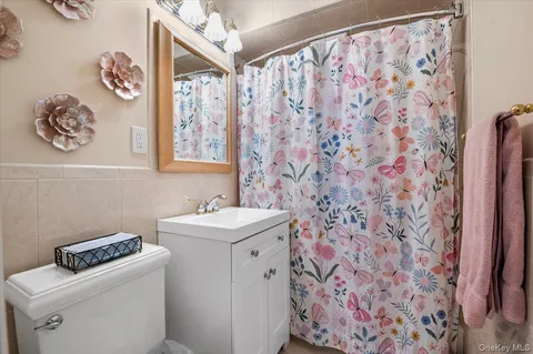 a bathroom with a sink and a stove