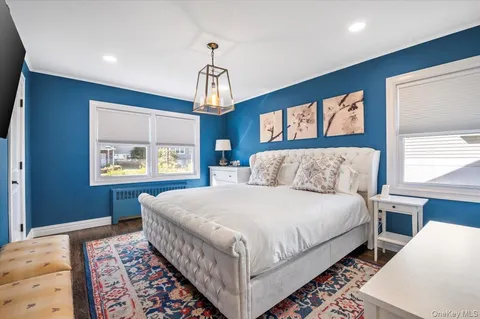 a bedroom with bed and window