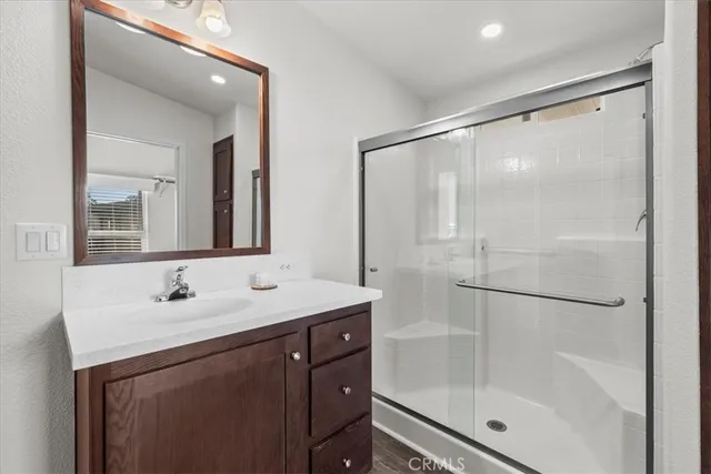 a bathroom with a shower a toilet and a shower