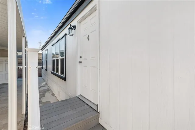 a living room with a large window and a table