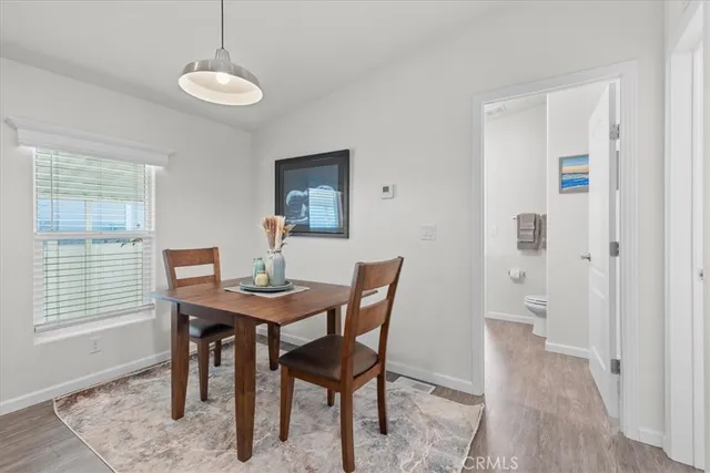 a living room kitchen with furniture and kitchen view