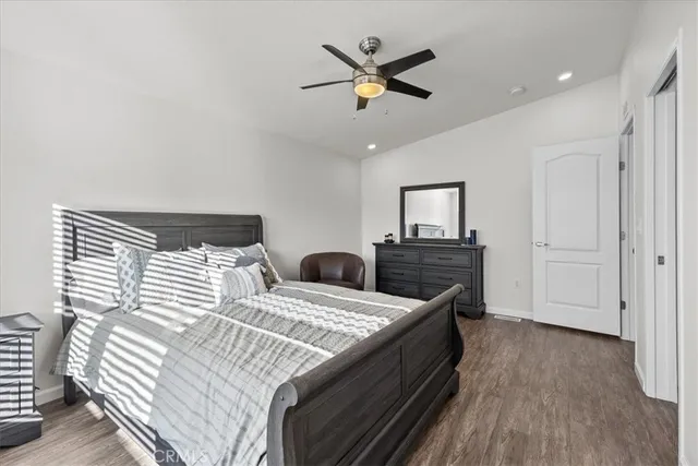 a bedroom with a bed couch and window