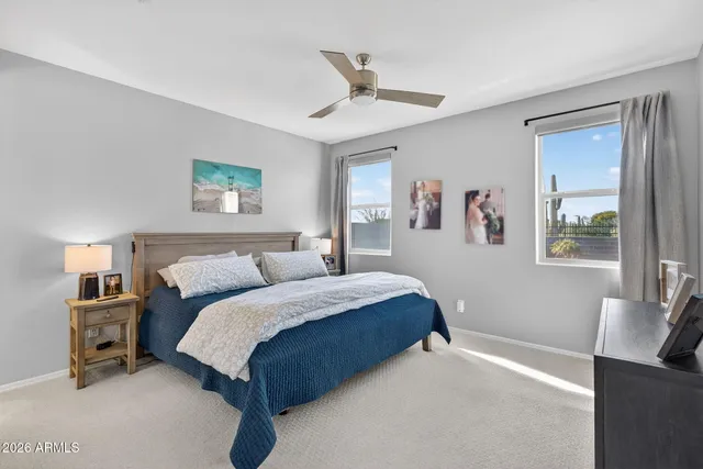 a spacious bedroom with a bed and a couch