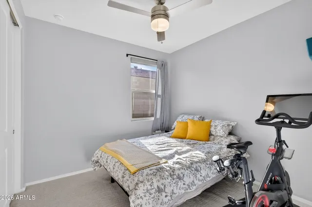 a bedroom with a bed and window