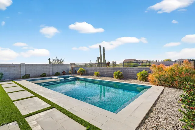 a view of a swimming pool with a lounge chairs