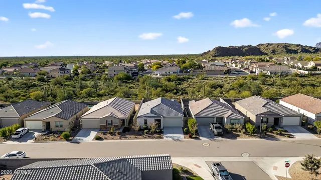a view of multiple houses with a city street