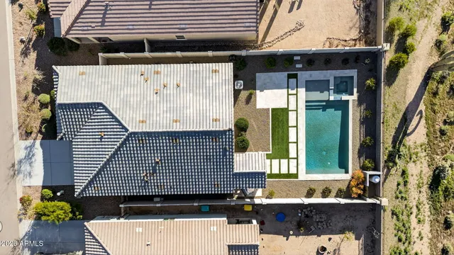 an aerial view of residential houses with outdoor space