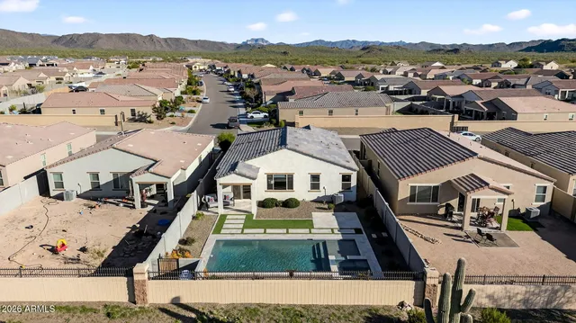 an aerial view of residential houses with outdoor space and street view