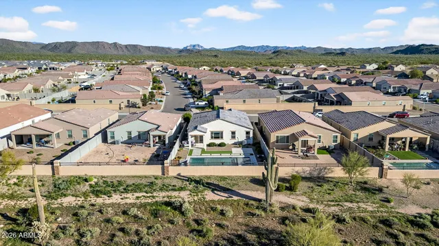 an aerial view of residential houses with outdoor space
