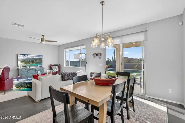 a view of a dining room with furniture window and outside view