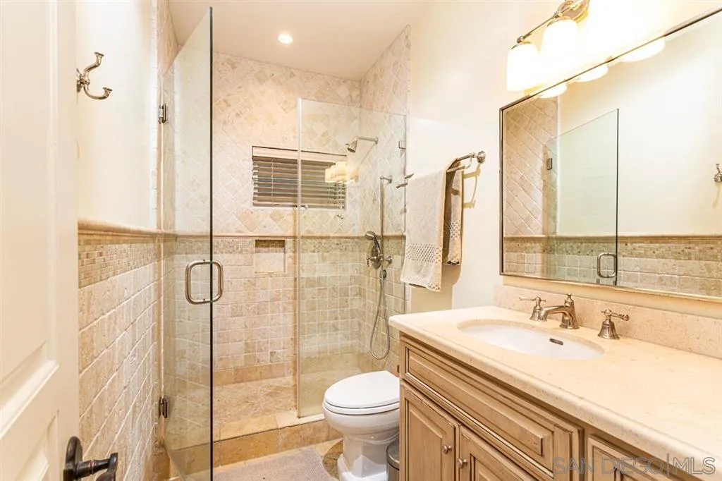 911 4th Street Coronado, CA 92118 - Photo 12 of 18 a bathroom with a sink toilet and shower