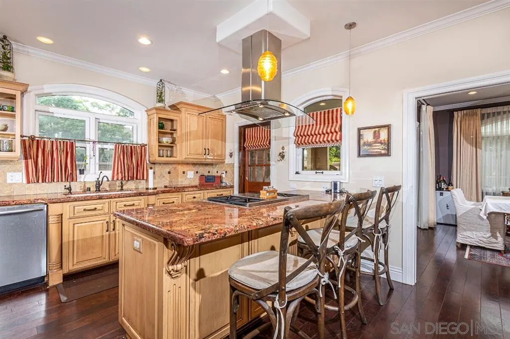 911 4th Street Coronado, CA 92118 - Photo 4 of 18 a kitchen with a table and chairs in it