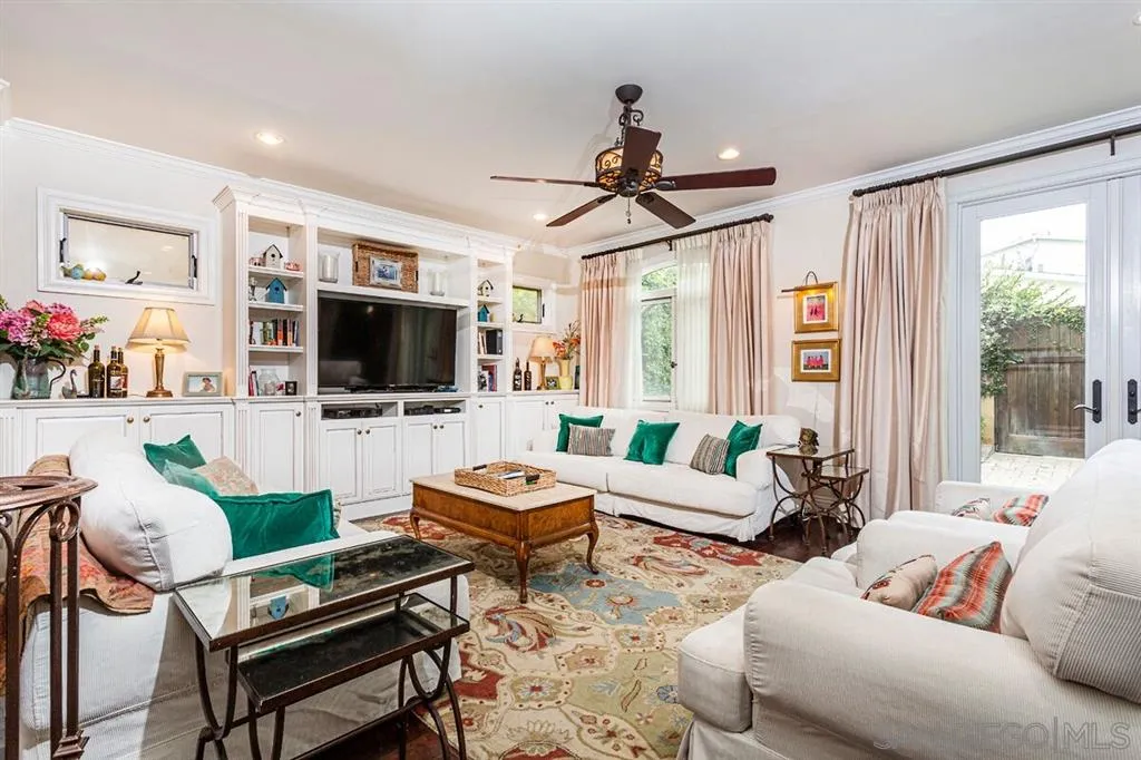 911 4th Street Coronado, CA 92118 - Photo 6 of 18 a living room with furniture a flat screen tv and a window