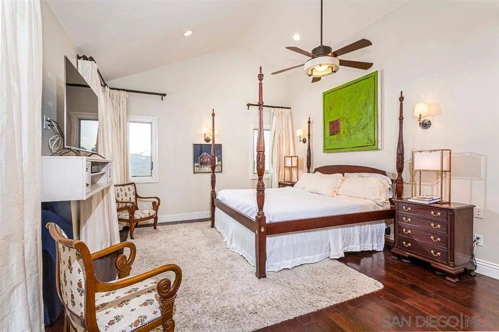 911 4th Street Coronado, CA 92118 - Photo 7 of 18 a bedroom with a bed dresser and a window