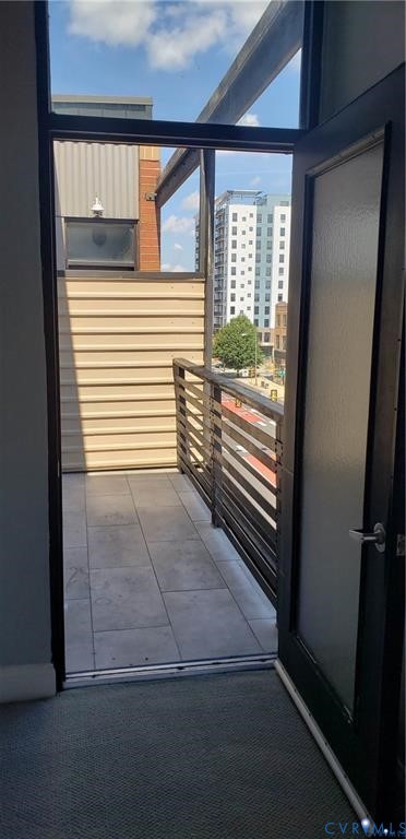 1333 West Broad Street, Unit 510 Richmond, VA 23220 - Photo 5 of 10 a view of a hallway with wooden floor and a window
