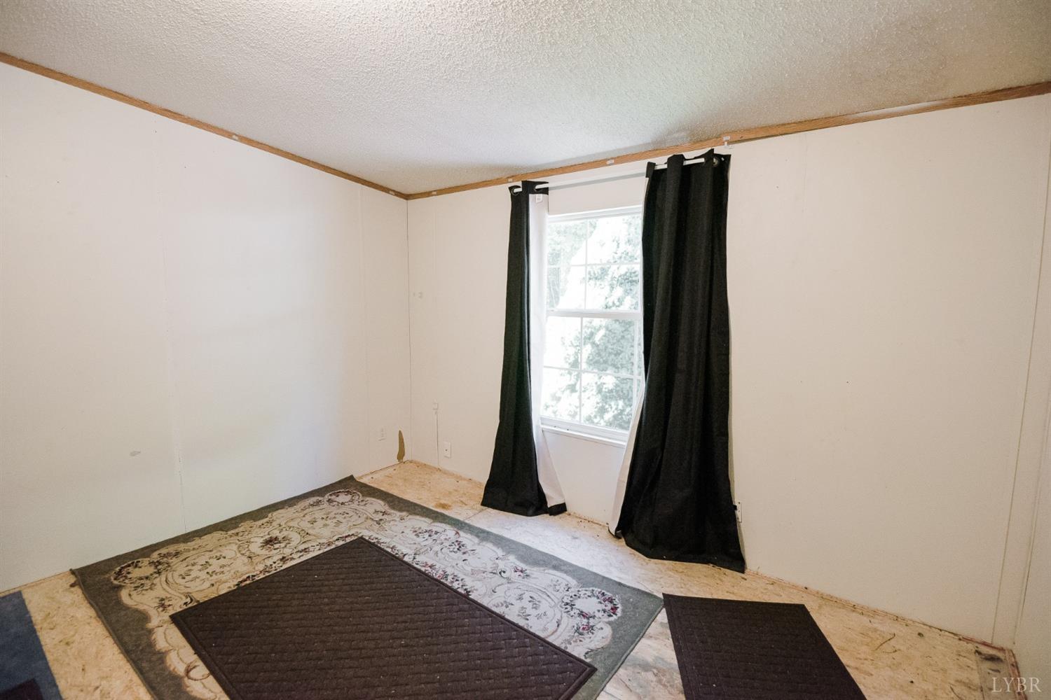 862 Snapps Mill Road Spout Spring, VA 24593 - Photo 25 of 29 a view of walk in closet with wooden floor