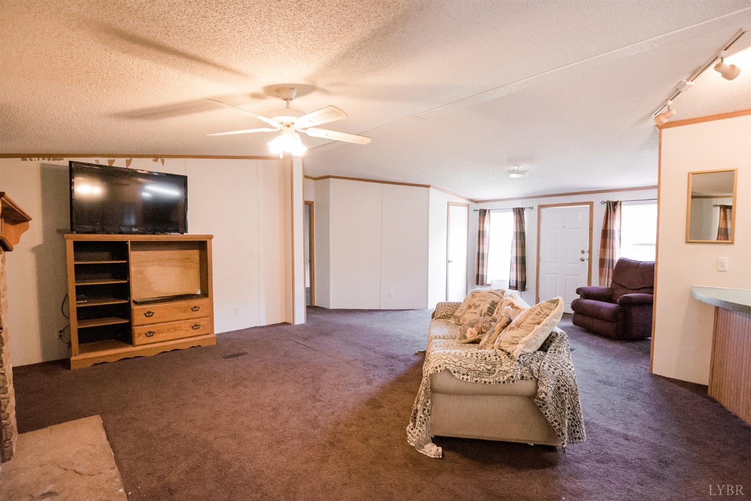 862 Snapps Mill Road Spout Spring, VA 24593 - Photo 8 of 29 a spacious bedroom with a bed and furniture