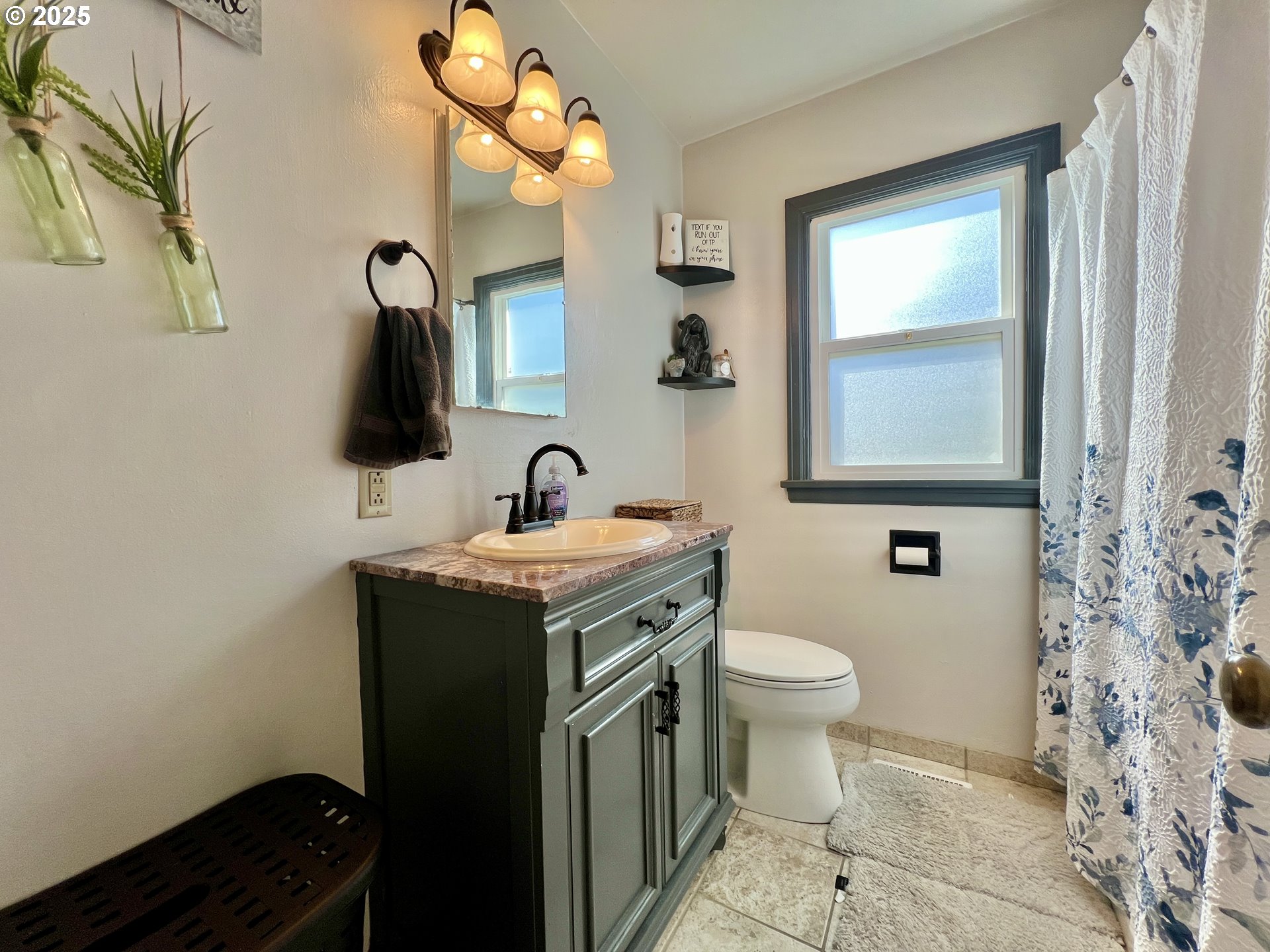 706 Northwest 10th Street Pendleton, OR 97801 - Photo 15 of 19 a bathroom with a sink a toilet and mirror