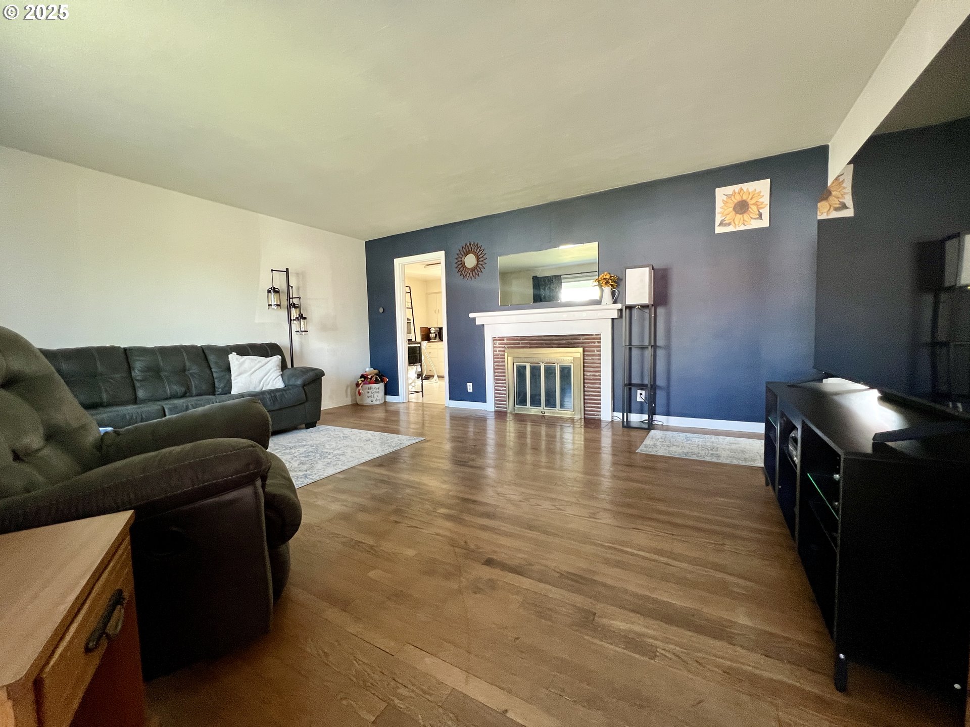 706 Northwest 10th Street Pendleton, OR 97801 - Photo 8 of 19 a living room with furniture and a fireplace