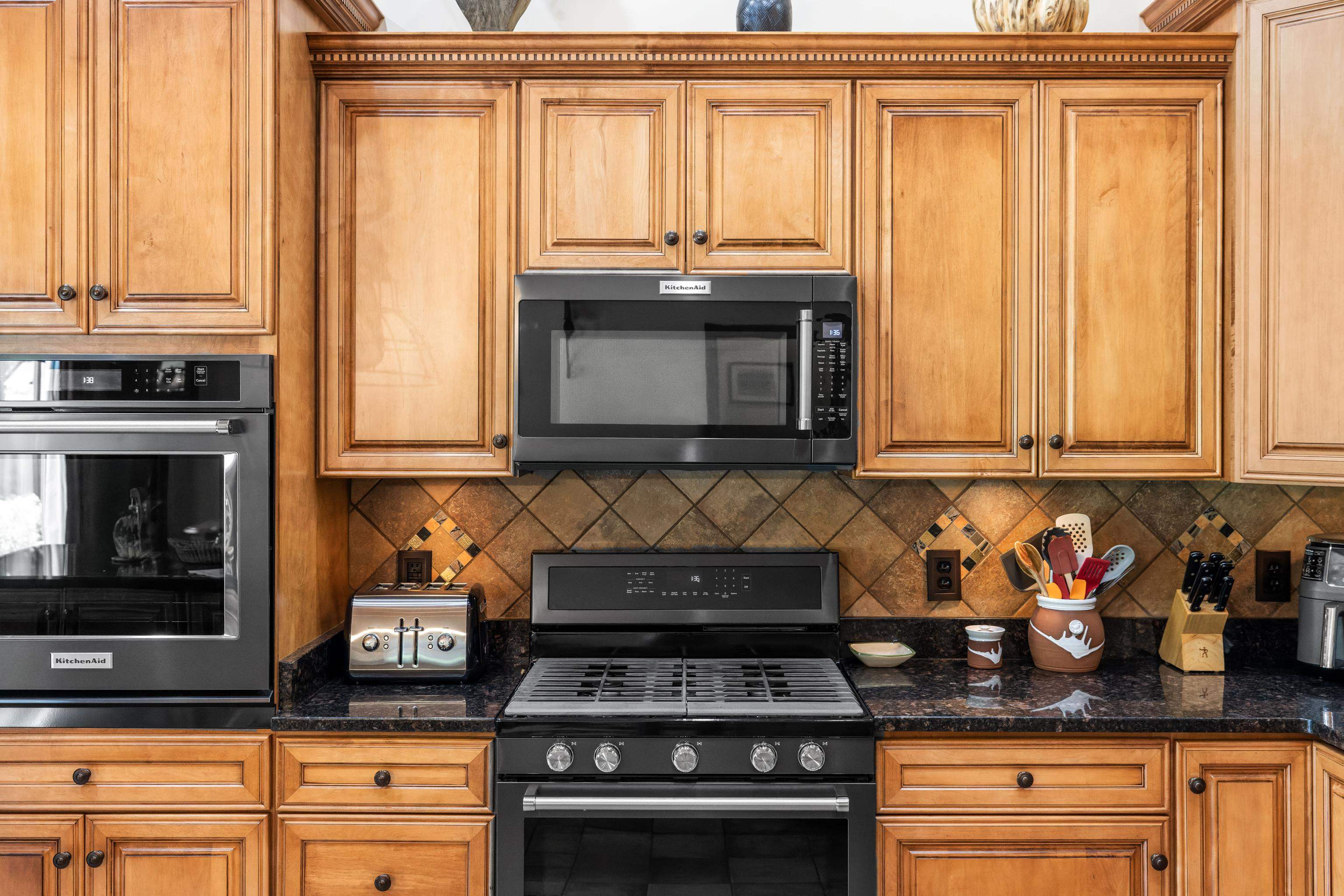 299 Summerdean Road Middlebrook, VA 24459 - Photo 16 of 67 a kitchen with granite countertop a stove a sink and a granite counter tops