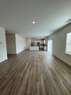 309 Amsterdam Way Hampton, GA 30228 - Photo 12 of 53 a view of empty room with wooden floor and lounge chair