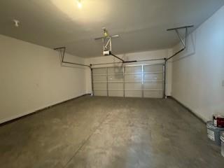 309 Amsterdam Way Hampton, GA 30228 - Photo 13 of 53 a view of a garage