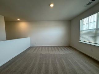 309 Amsterdam Way Hampton, GA 30228 - Photo 19 of 53 a view of an empty room and a window