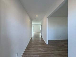 309 Amsterdam Way Hampton, GA 30228 - Photo 2 of 53 a view of a hallway with wooden floor