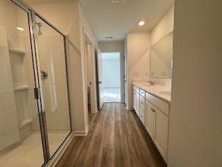 309 Amsterdam Way Hampton, GA 30228 - Photo 26 of 53 a view of a hallway with wooden floor and staircase