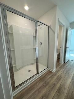 309 Amsterdam Way Hampton, GA 30228 - Photo 27 of 53 a bathroom with a glass shower door