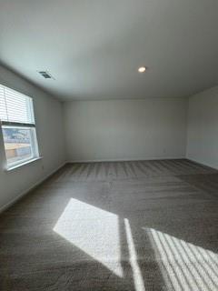 309 Amsterdam Way Hampton, GA 30228 - Photo 31 of 53 an empty room with wooden floor and windows