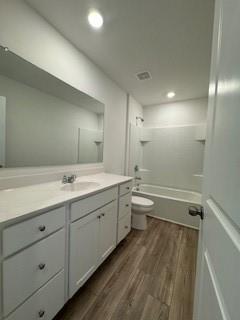 309 Amsterdam Way Hampton, GA 30228 - Photo 40 of 53 a bathroom with double vanity sink a toilet a and mirror