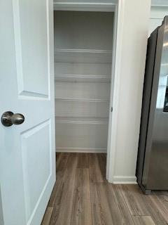 309 Amsterdam Way Hampton, GA 30228 - Photo 6 of 53 a view of walk in closet with empty racks