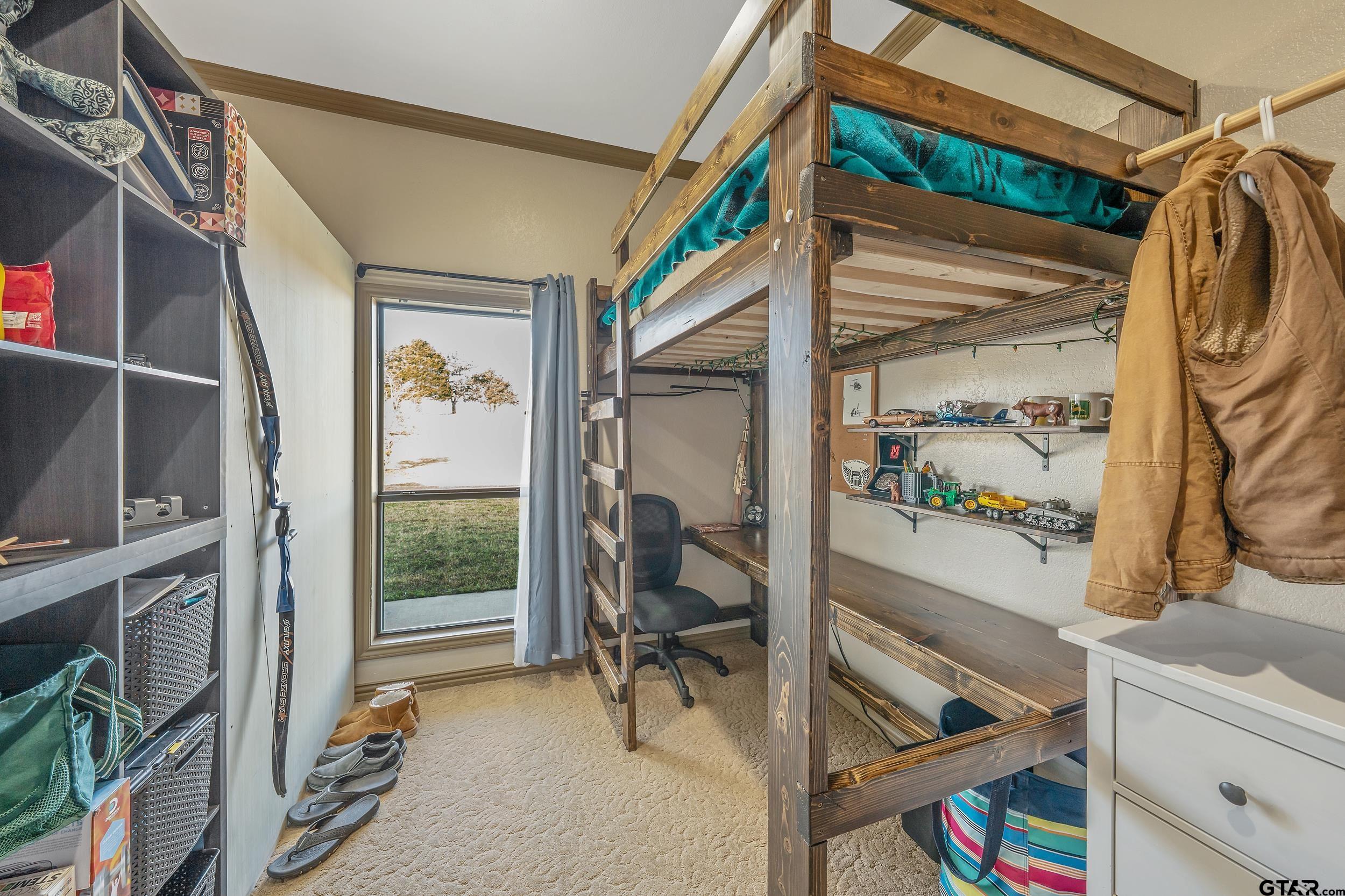 488 VZ County Road Ben Wheeler, TX 75754 - Photo 4 of 47 a view of walk in closet with clothes and shoes