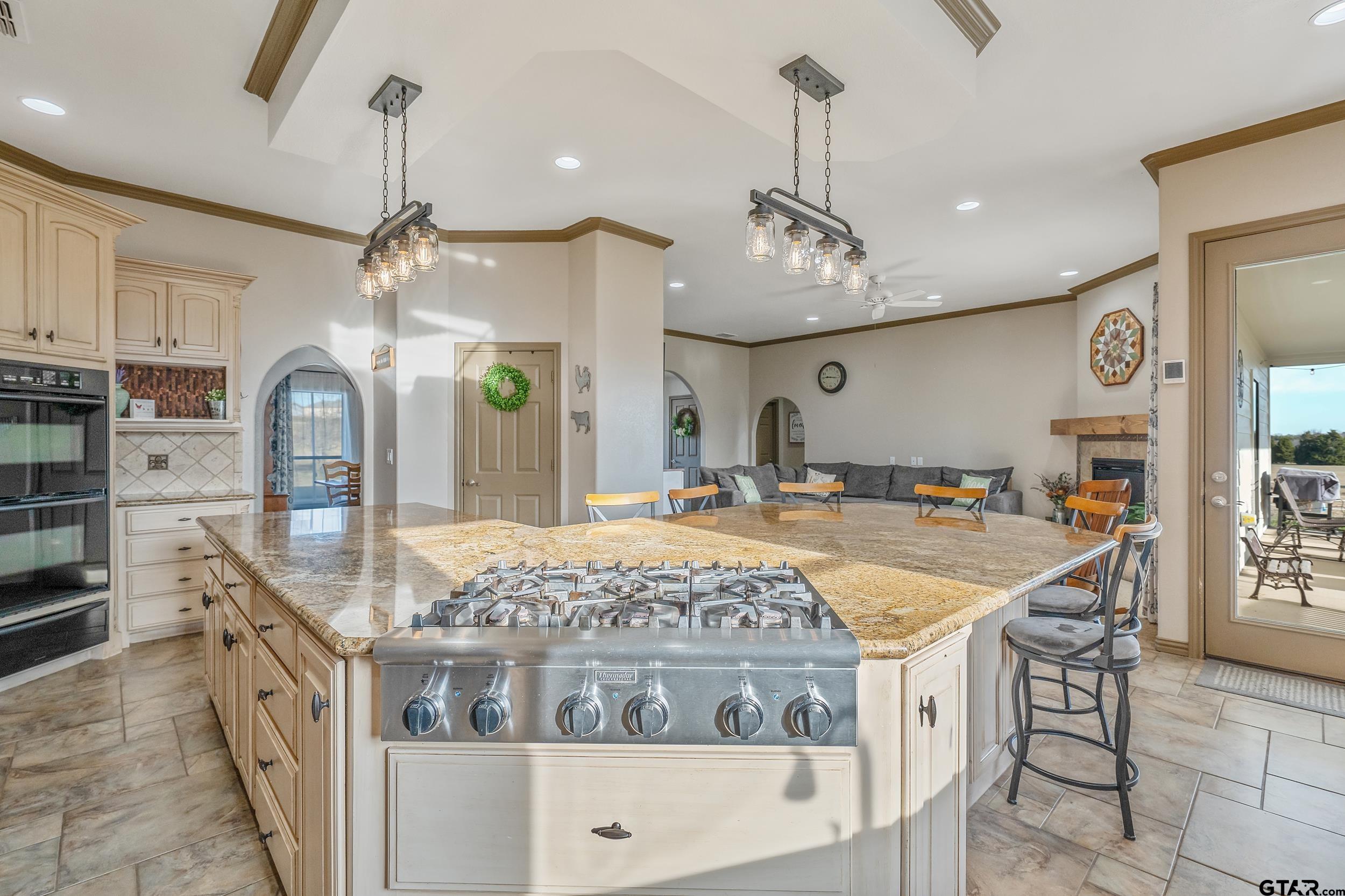 488 VZ County Road Ben Wheeler, TX 75754 - Photo 41 of 47 a kitchen with stainless steel appliances granite countertop a stove and a wooden floors
