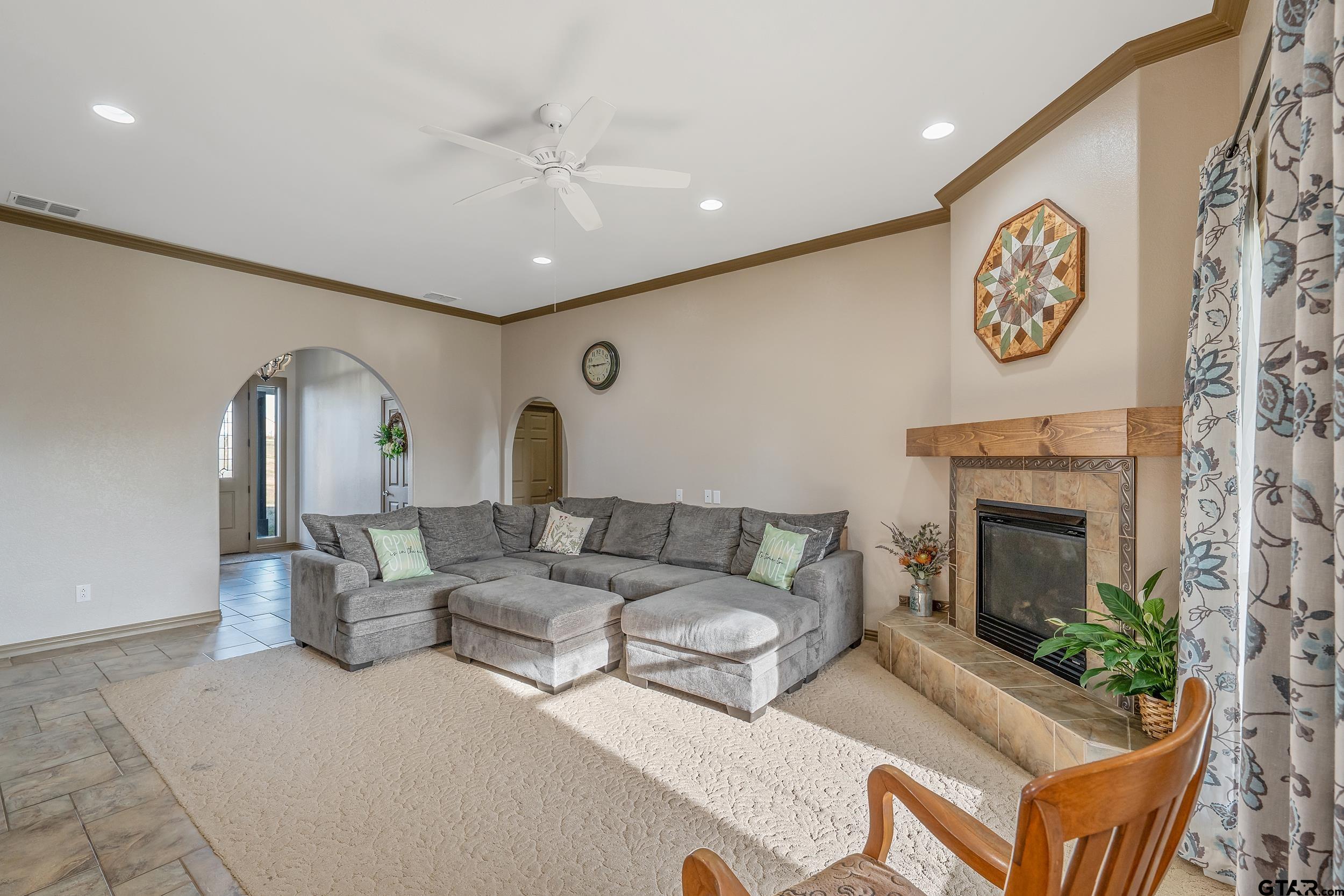 488 VZ County Road Ben Wheeler, TX 75754 - Photo 42 of 47 a living room with furniture a clock and a fireplace